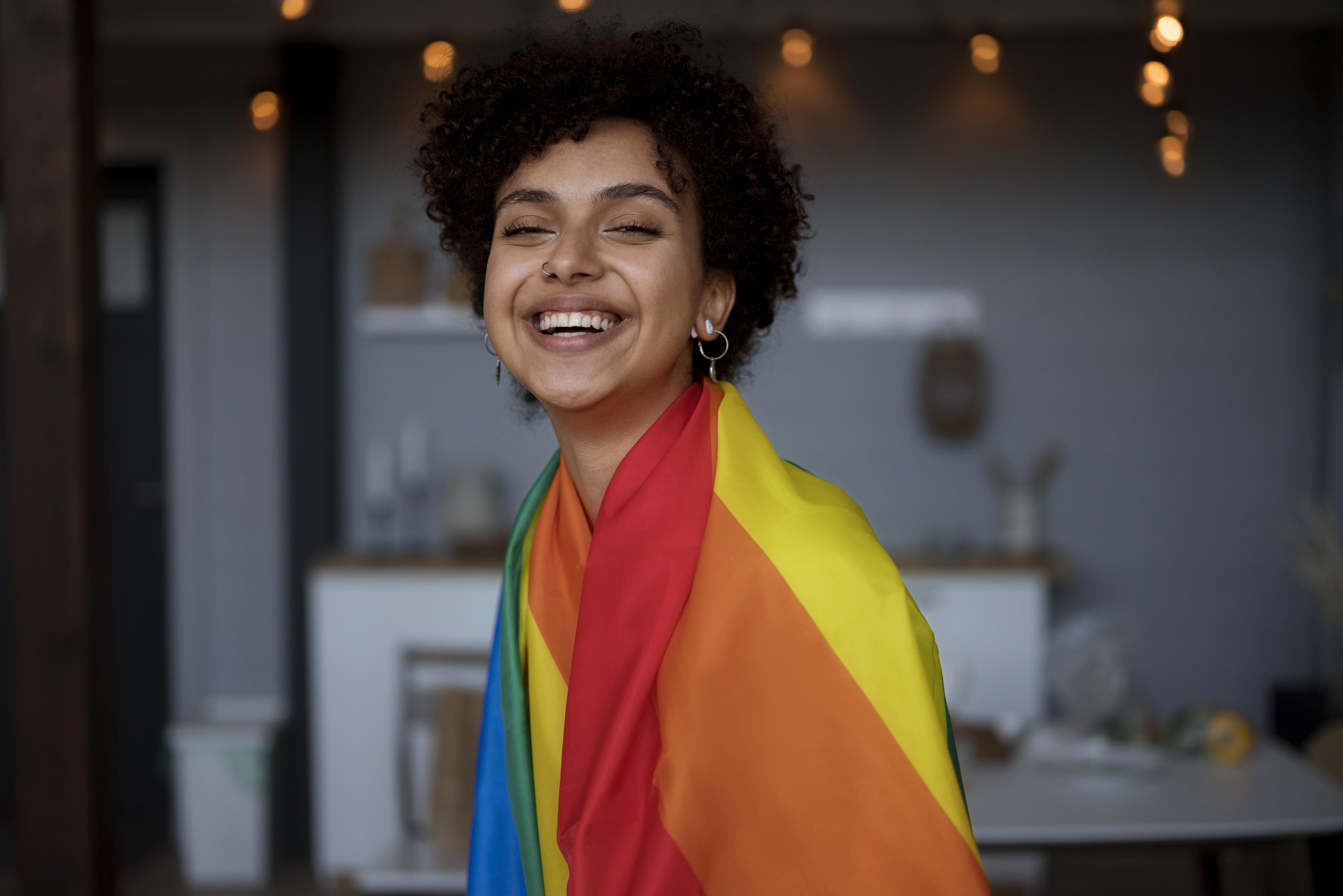 beautiful-curly-woman-with-lgbt-flag
