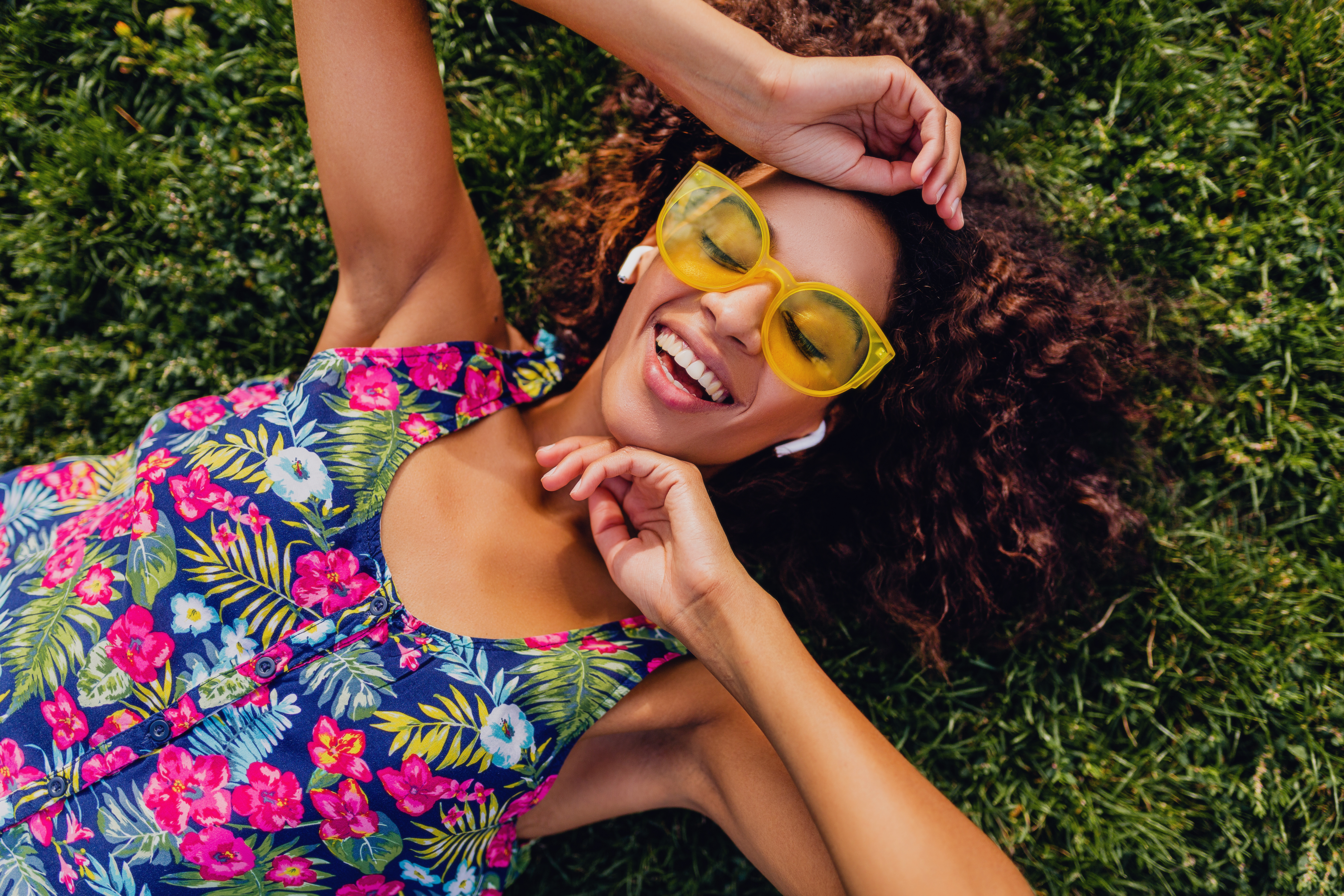 https://4800530.fs1.hubspotusercontent-na1.net/hubfs/4800530/young-stylish-black-woman-listening-music-wireless-earphones-having-fun-park-summer-fashion-style-colorful-hipster-outfit-lying-grass-view-from.jpg